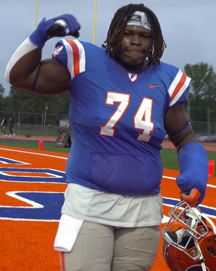 East St. Louis football players on the field